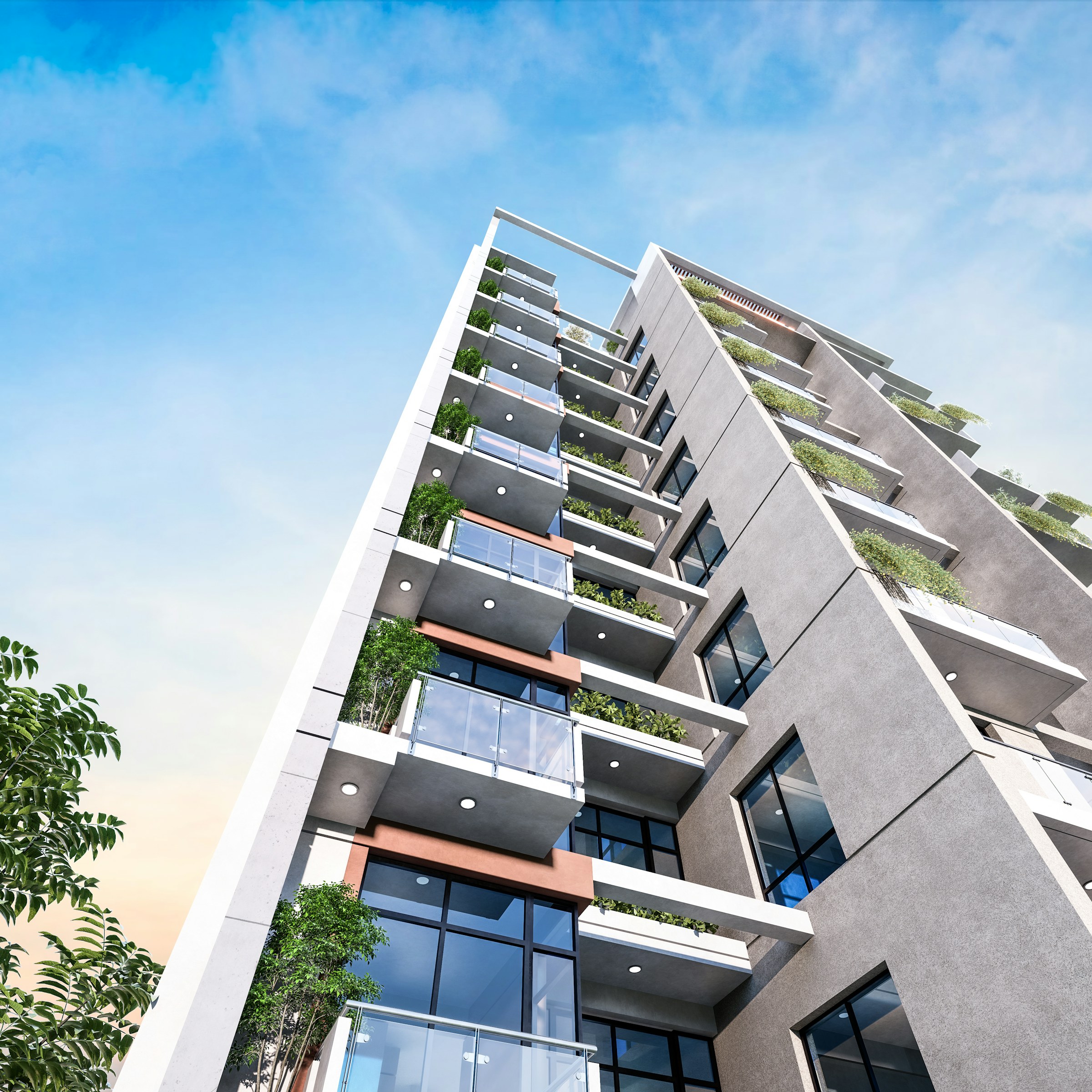 Contemporary residential building viewed from below, with glass balconies, modern facade details, and integrated greenery.